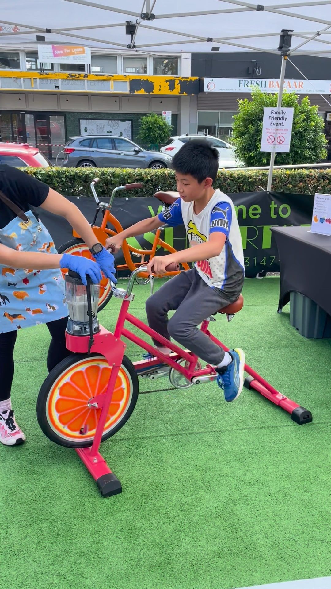 A young boy tries the coral smoothie bike